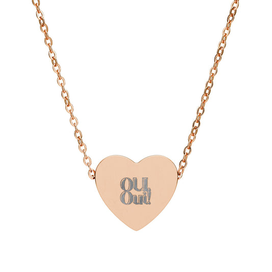 Rose gold heart-shaped necklace with 'OU Out!' engraving on a white background