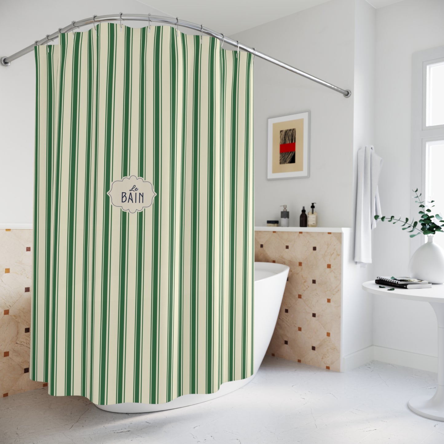 A green and cream striped shower curtain hanging in a bright, modern bathroom. The curtain features vertical stripes in shades of green and cream, with a central decorative label that reads 'A BATH'.