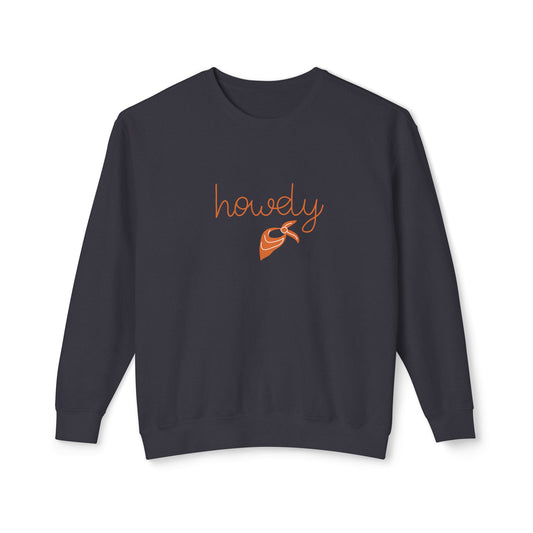 A dark navy crewneck sweatshirt with 'howdy' written in orange cursive script and a small orange bandana graphic on the chest, displayed against a plain white background.