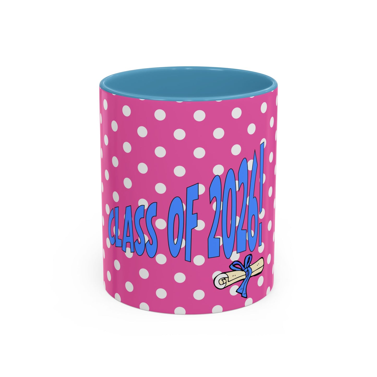Pink polka dot mug with blue interior, 'Class of 2023!' text, and graduation cap icon on a white background
