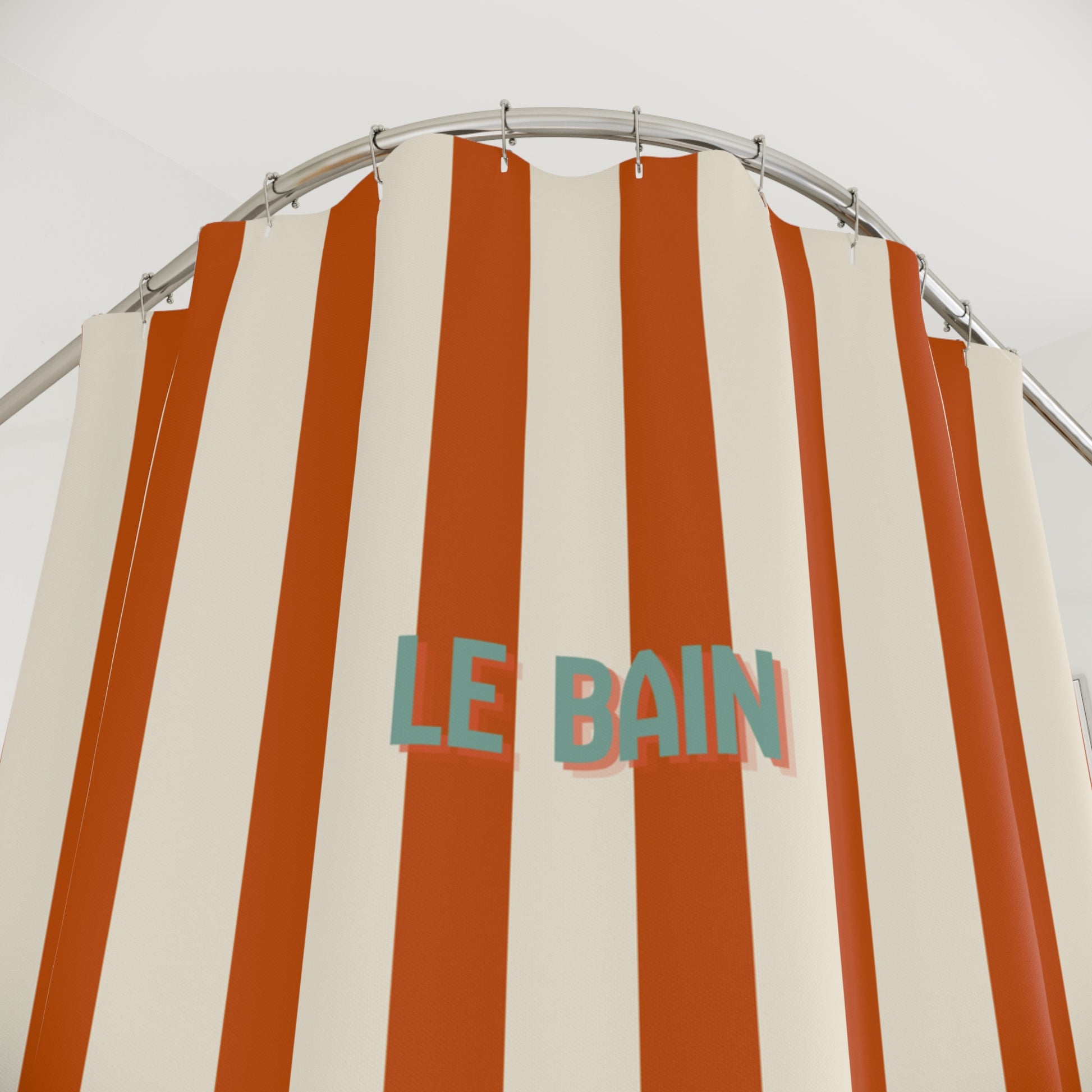 Striped shower curtain with 'LE BAIN' text on a white background