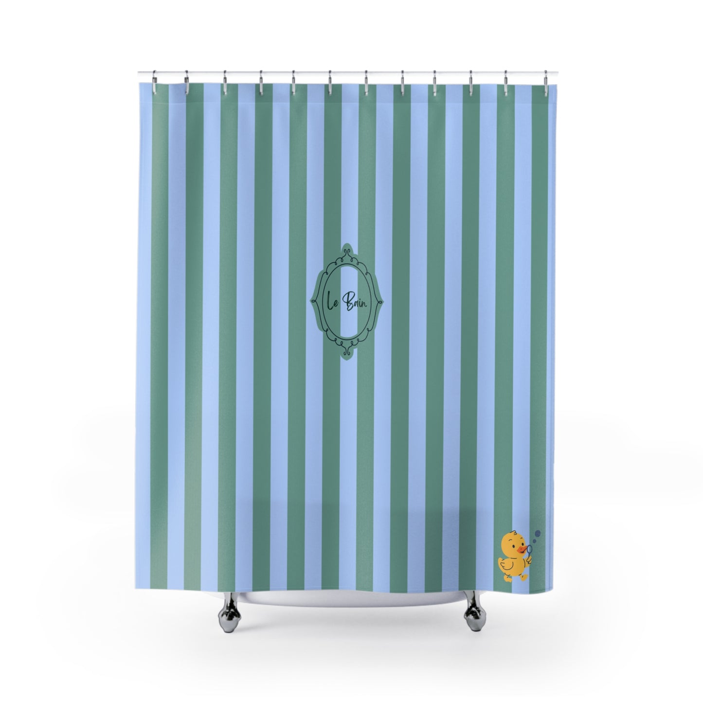 A shower curtain with vertical stripes in light blue, teal, and mint green, featuring a central green decorative frame with the text 'la Ba' and a small yellow duck character in the bottom right corner.