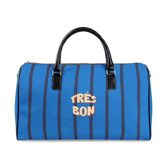 Blue striped duffel bag with 'Très Bon' text on a white background