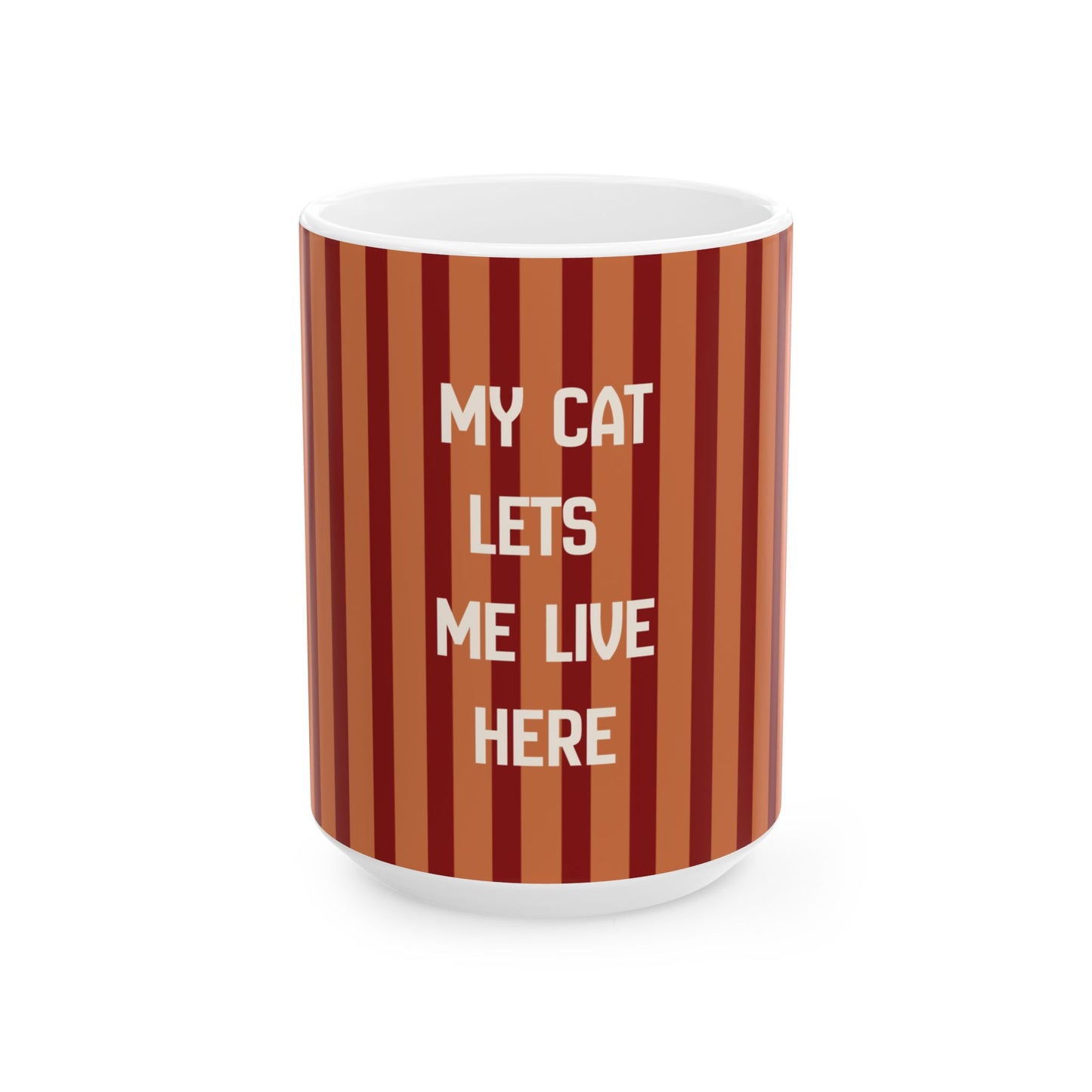 A white ceramic mug featuring a vertical striped pattern in shades of terracotta, rust, and dark red, with the text 'MY CAT LETS ME LIVE HERE' printed in white capital letters on the front.