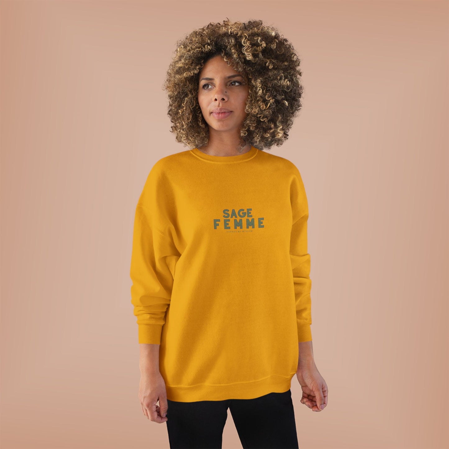 Woman wearing a yellow sweatshirt with 'SAGE FEMME' text on a beige background