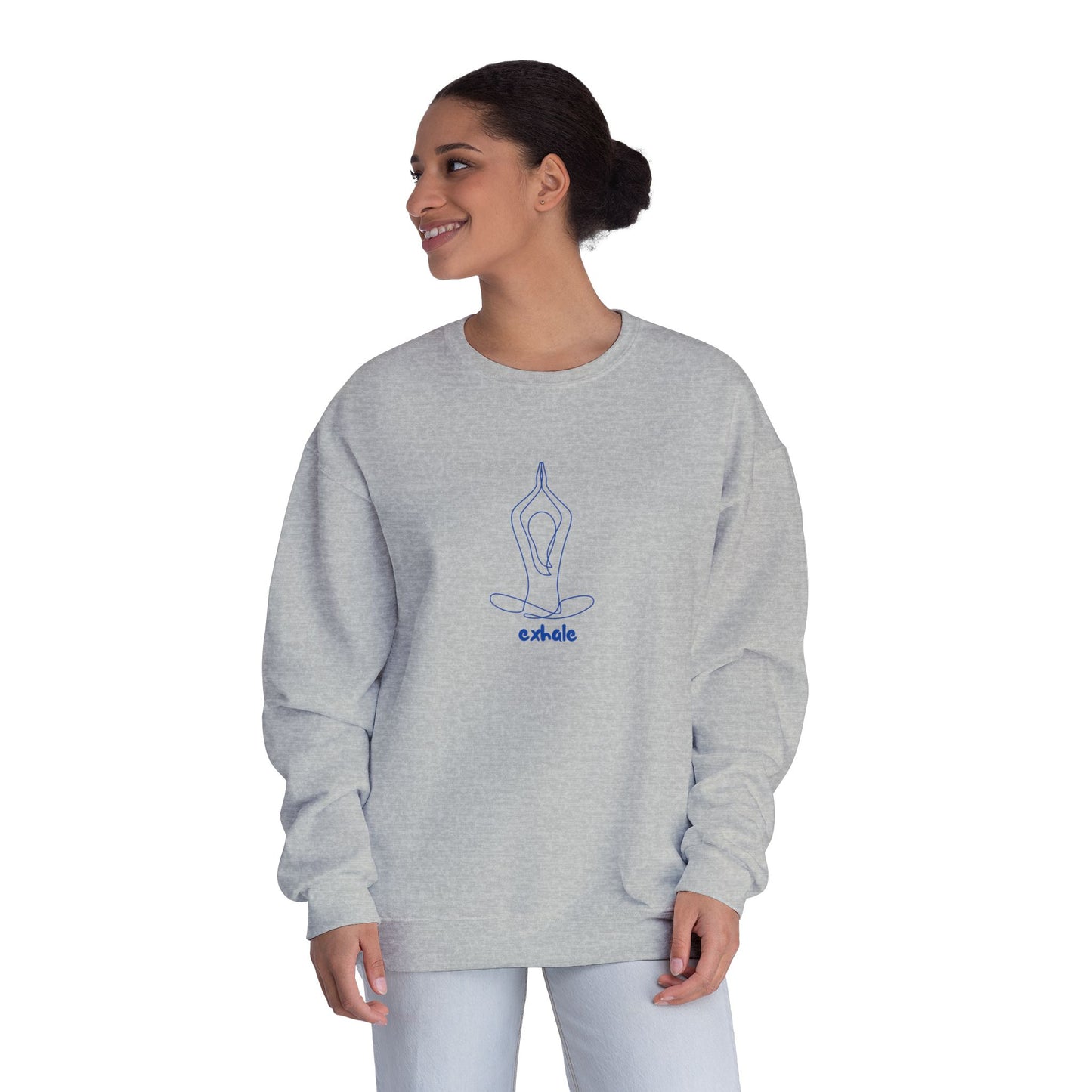 Woman wearing a gray sweatshirt with a blue design on a white background