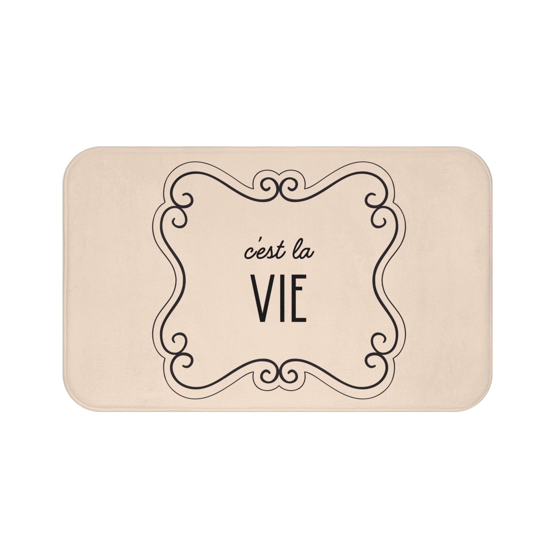 Beige mat with 'c'est la Vie' text and decorative frame on a white background