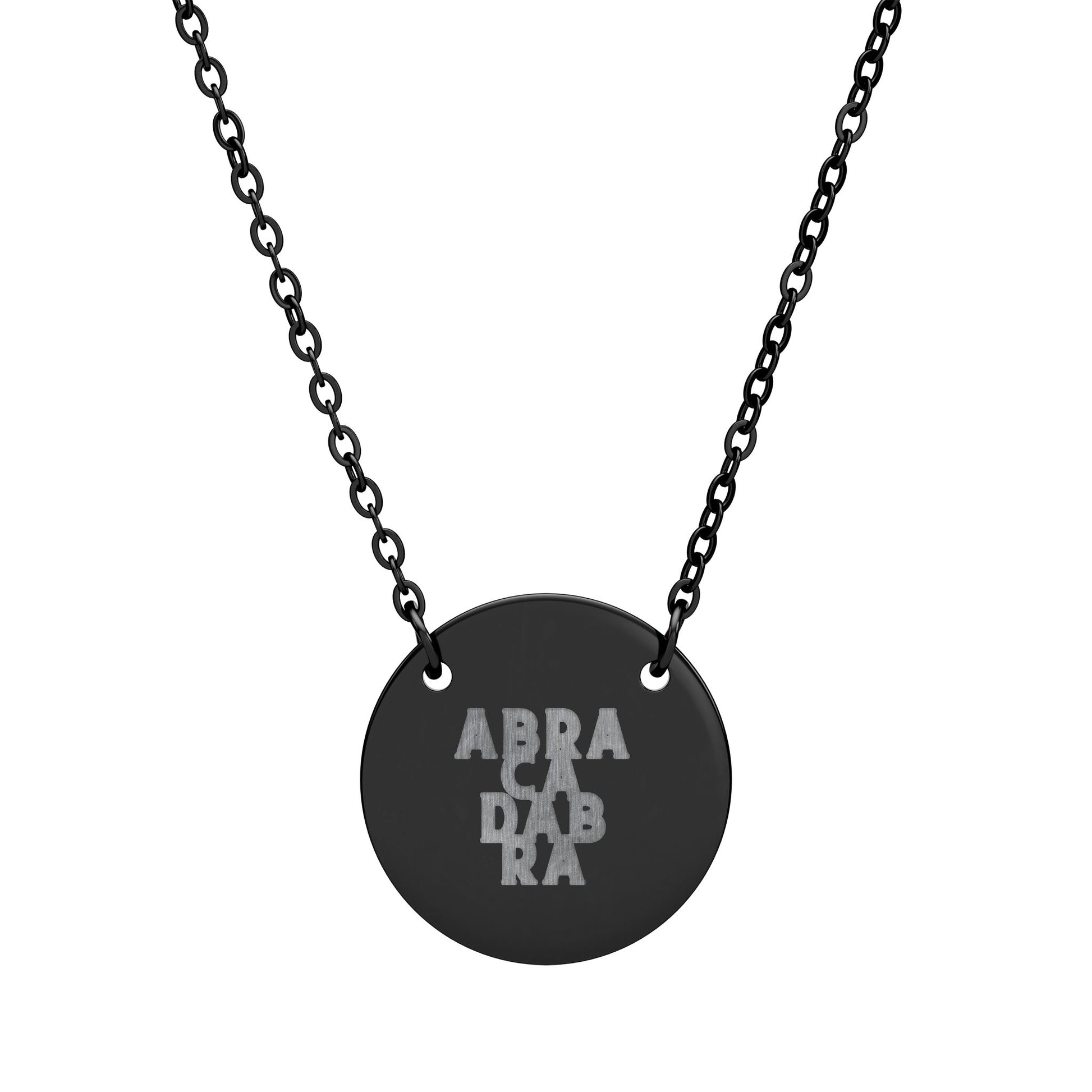 Black necklace with a round pendant featuring 'ABRACADABRA' on a white background