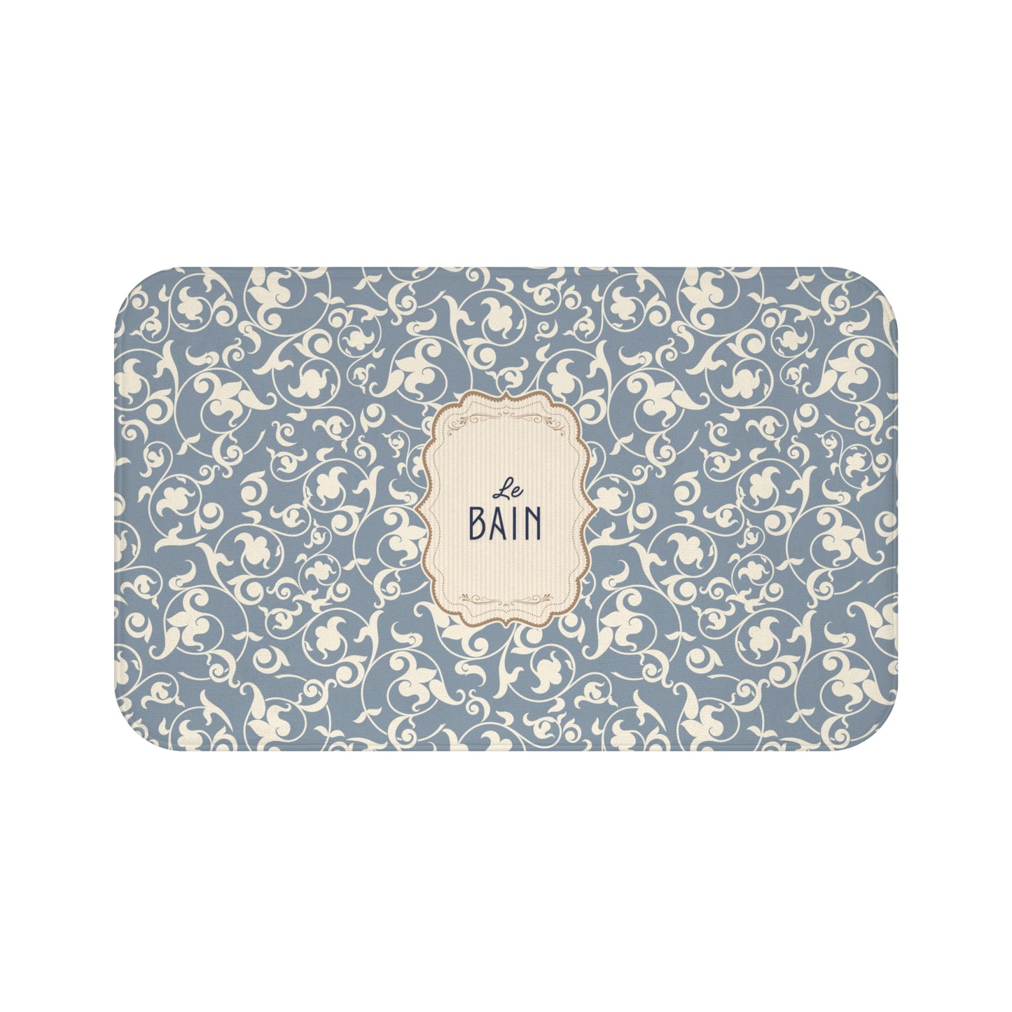 Decorative bath mat with floral pattern and 'Le Bain' text on a blue background