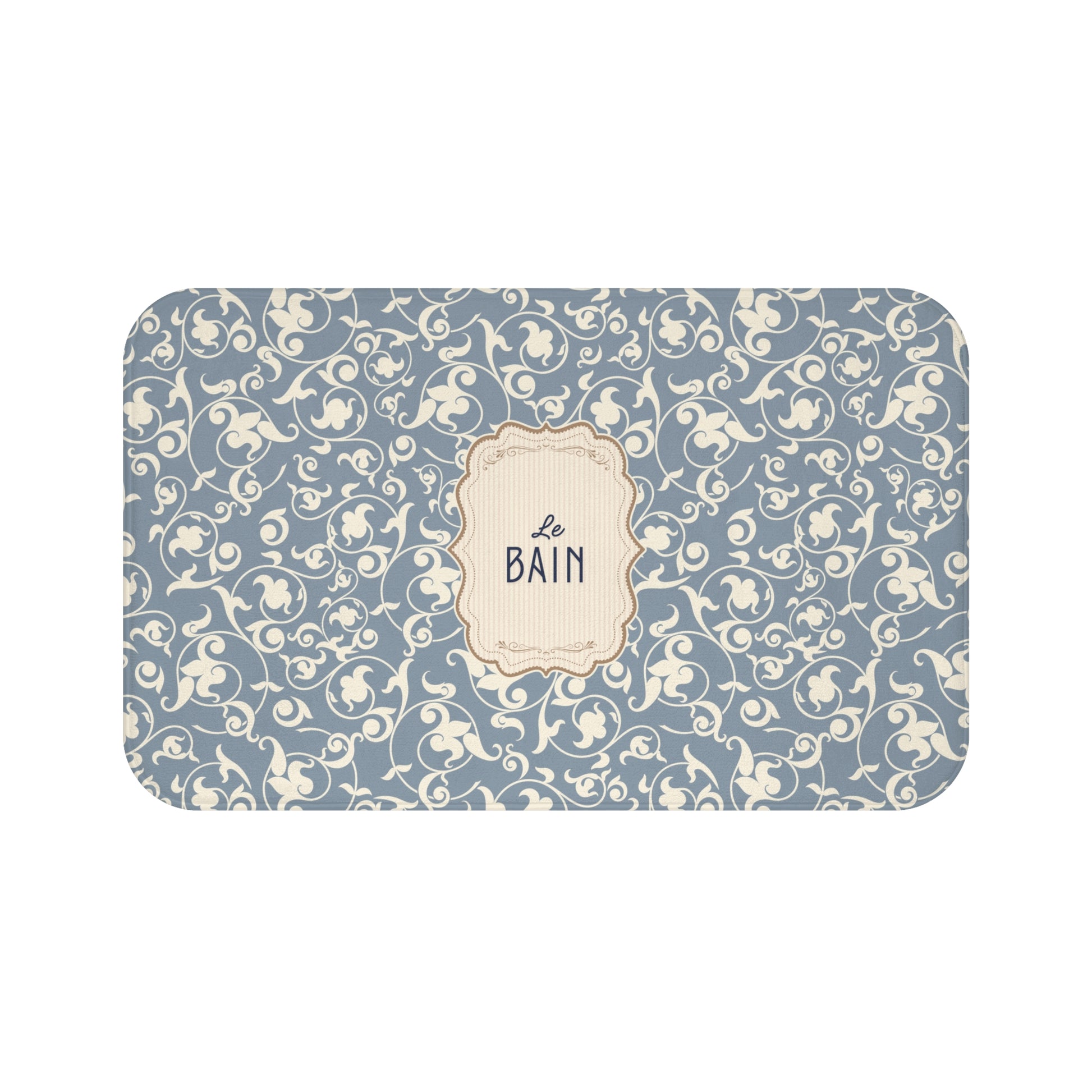 Decorative bath mat with floral pattern and 'Le Bain' text on a blue background