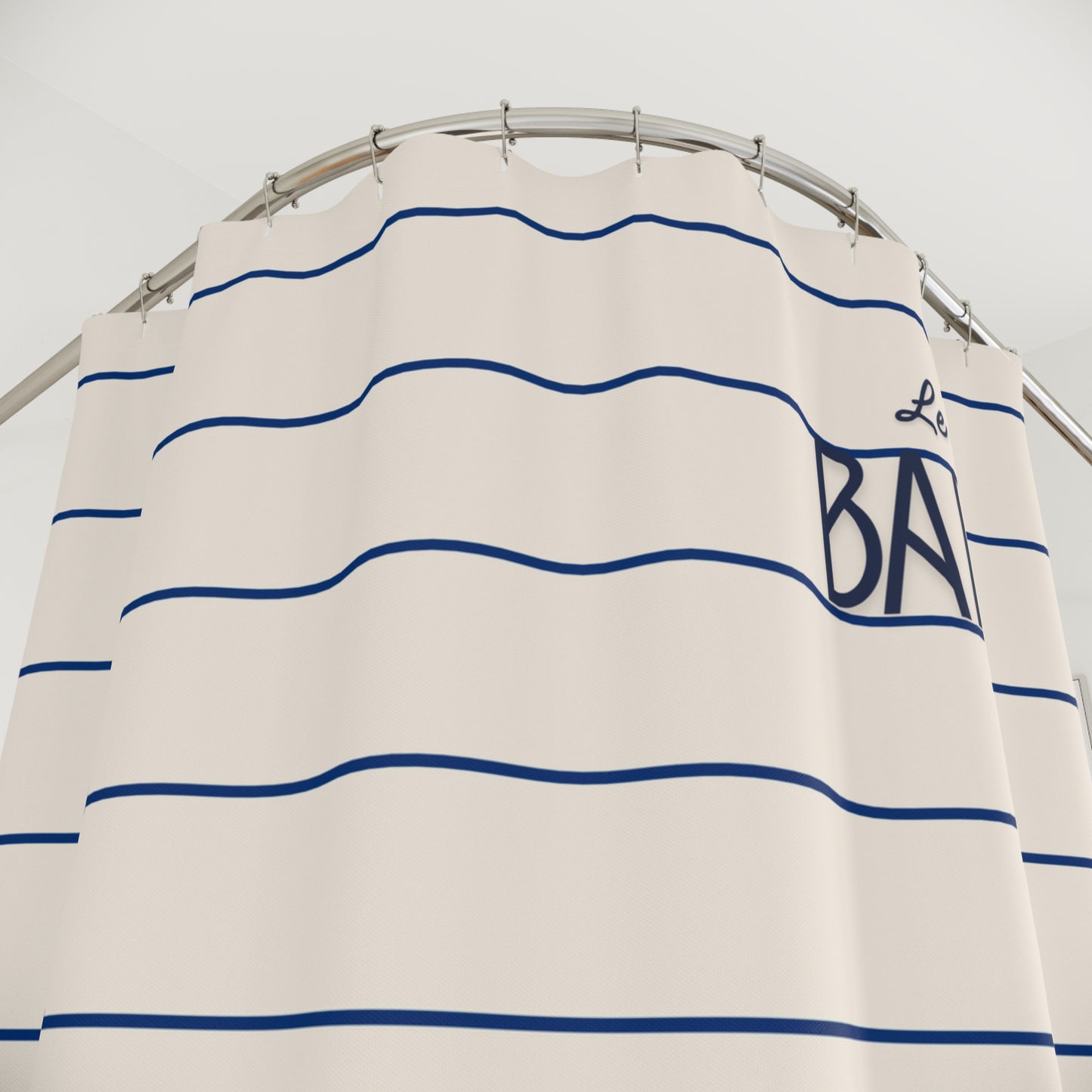 Striped shirt with blue lines and 'Le Bateau' branding on a hanger against a white background