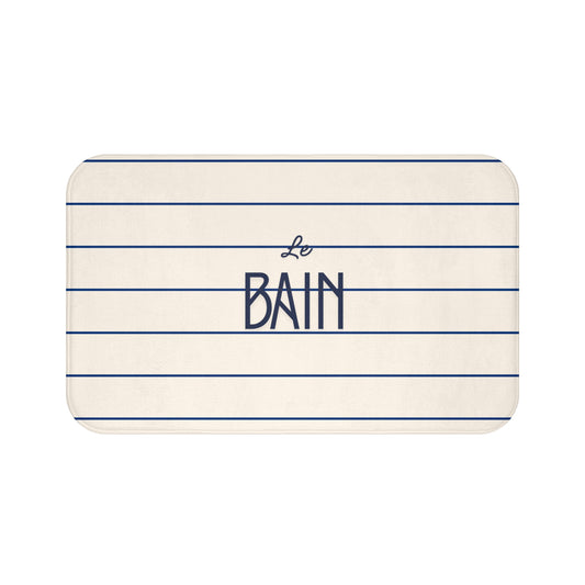 Rectangular bath mat with 'Le Bain' text on a white background