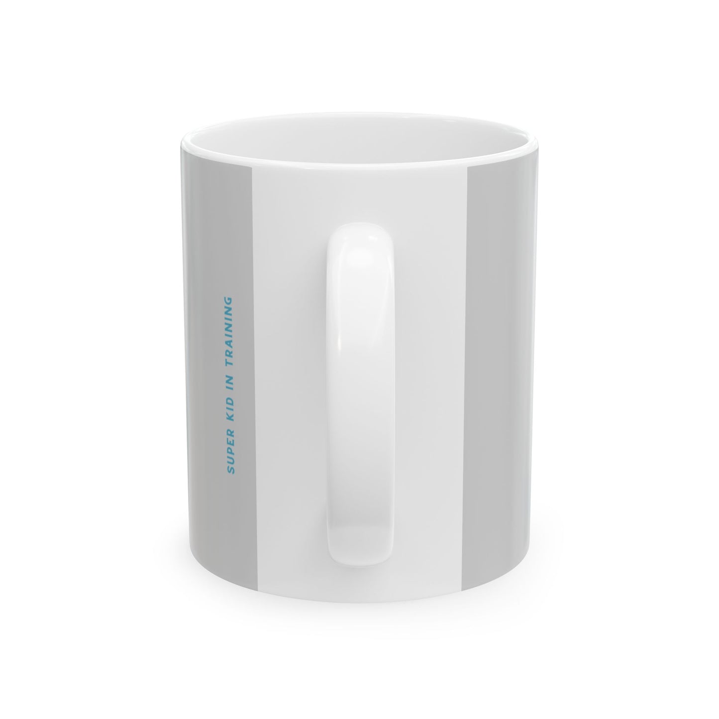 A white ceramic mug with a vertical gray stripe on the side featuring the text 'SUPER KID IN TRAINING' in light blue, shown on a clean white background.