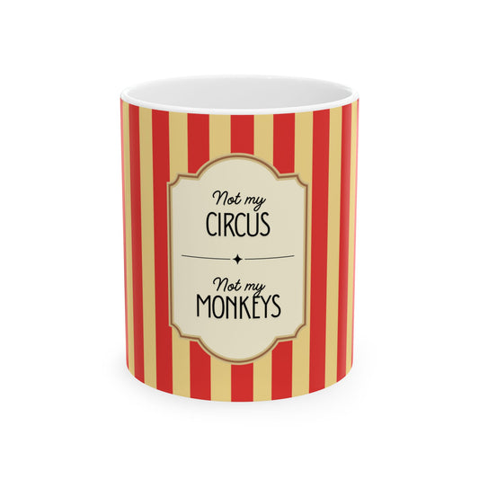 Mug with red and yellow striped pattern and 'Not my circus, not my monkeys' text on a white background