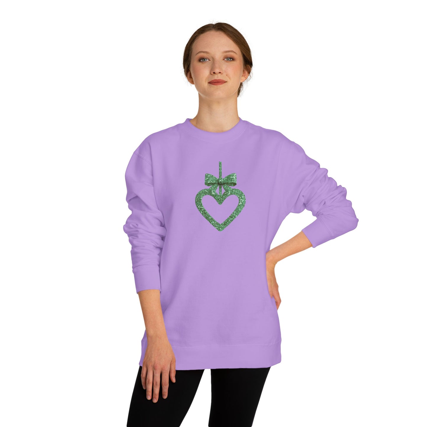 Person wearing a purple sweatshirt with a green heart design on a white background
