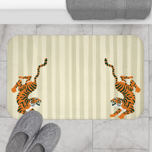Bath mat with tiger design on a striped background, placed on a tiled floor.