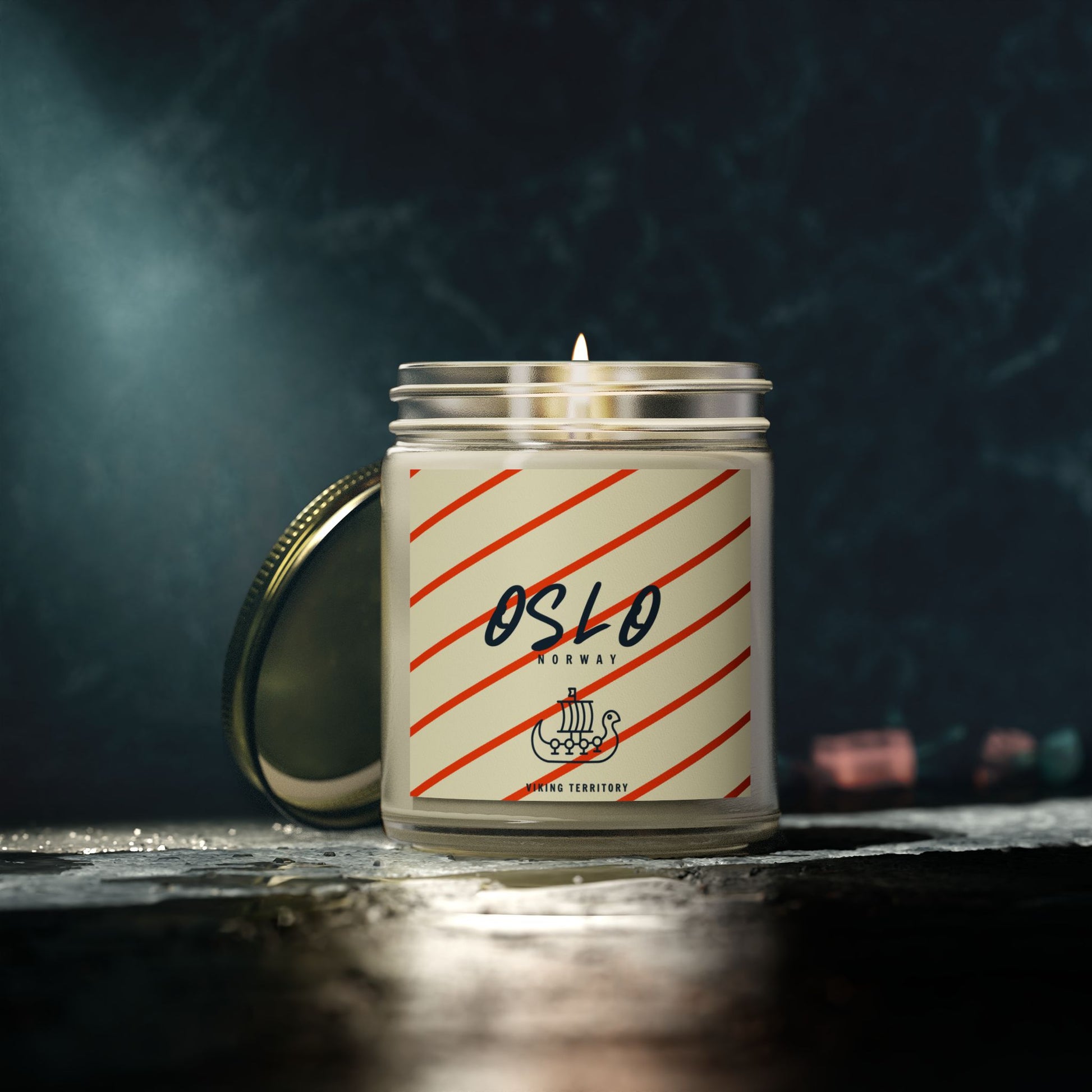 Candle with 'Oslo' label on a dark background