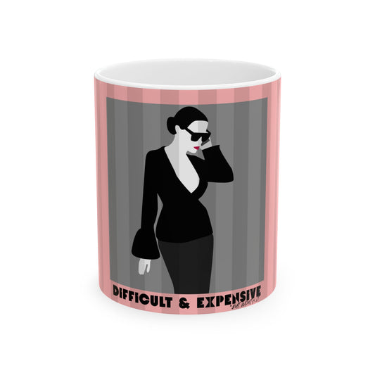 A white ceramic mug featuring a graphic print of a woman in a black outfit and sunglasses against gray vertical stripes, framed by pink side borders with the text 'DIFFICULT & EXPENSIVE' at the bottom.