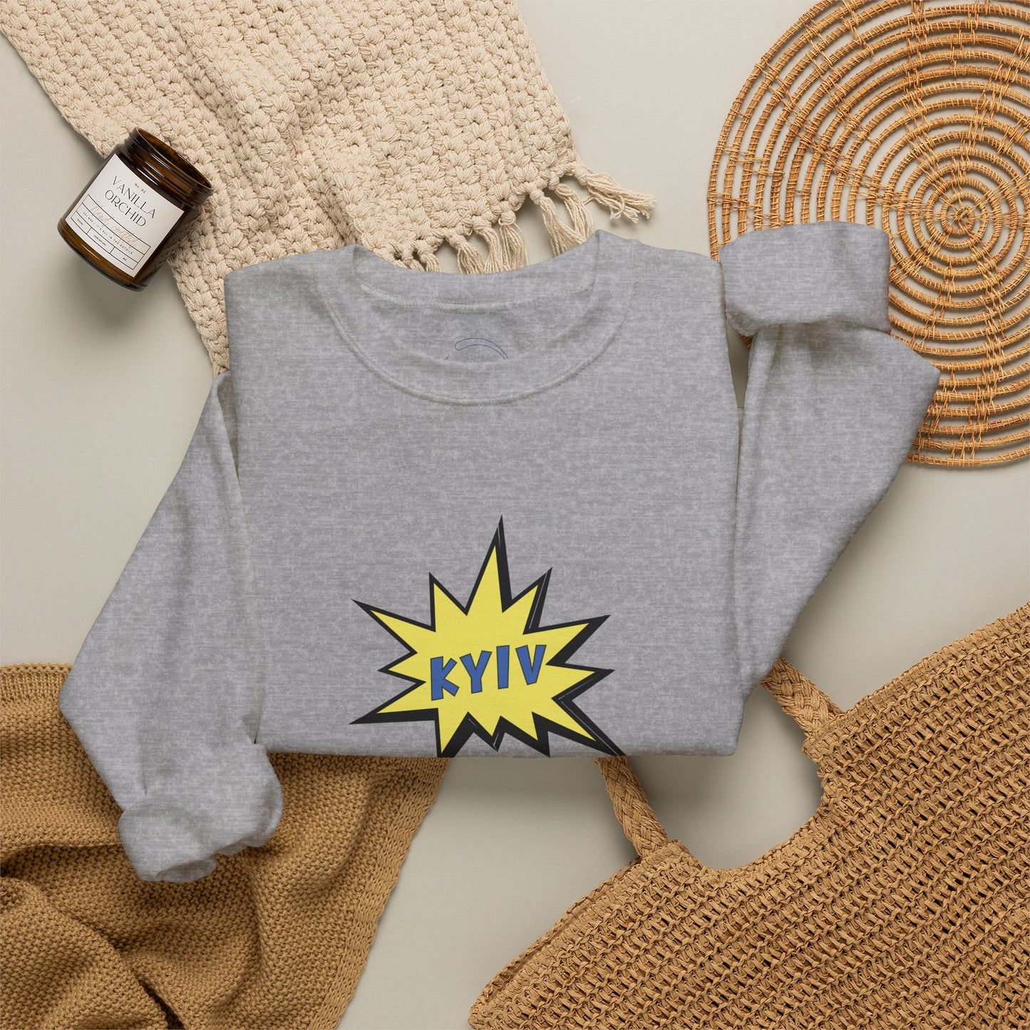 Gray sweatshirt with 'KYIV' design on a textured surface