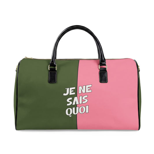 Two-toned green and pink bag with black handles and white text on a white background