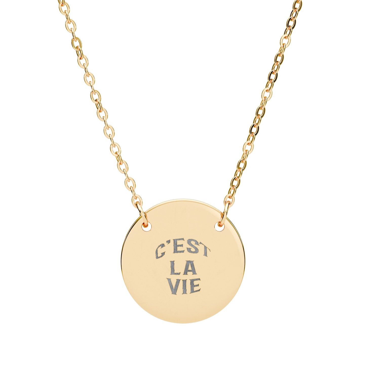Gold necklace with a round pendant engraved with 'C'EST LA VIE' on a white background