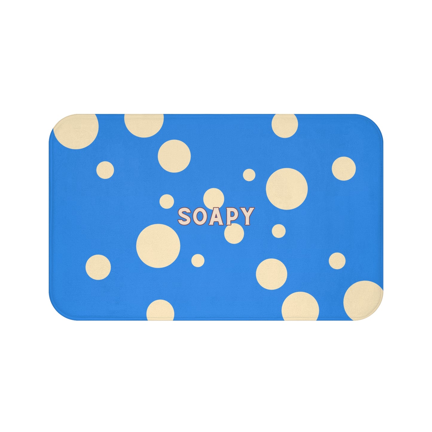 A rectangular blue bath mat with rounded corners, decorated with scattered beige polka dots and the word 'SOAPY' printed in beige at the center, shown on a plain white background.