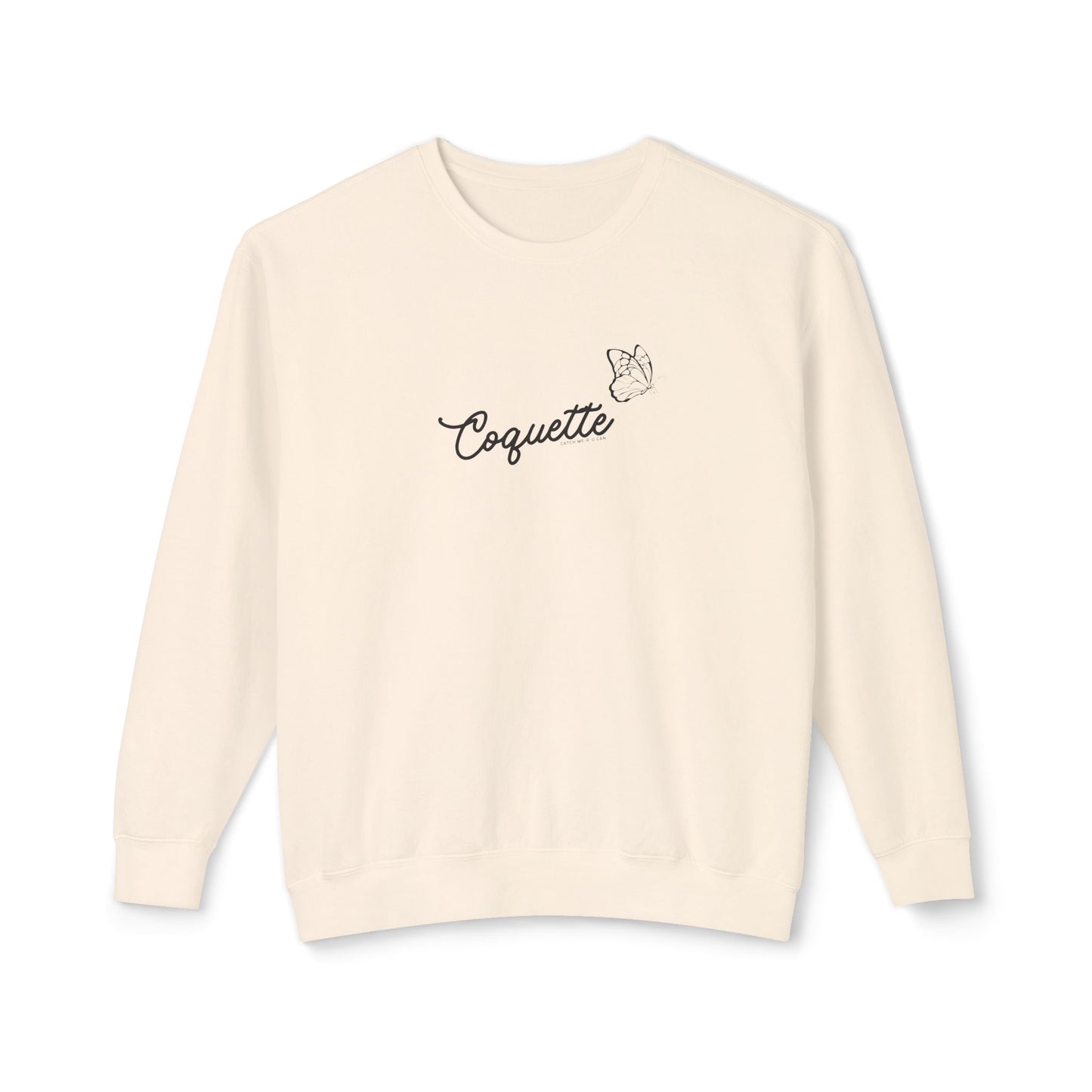 Beige sweater with 'Coquette' text on a white background