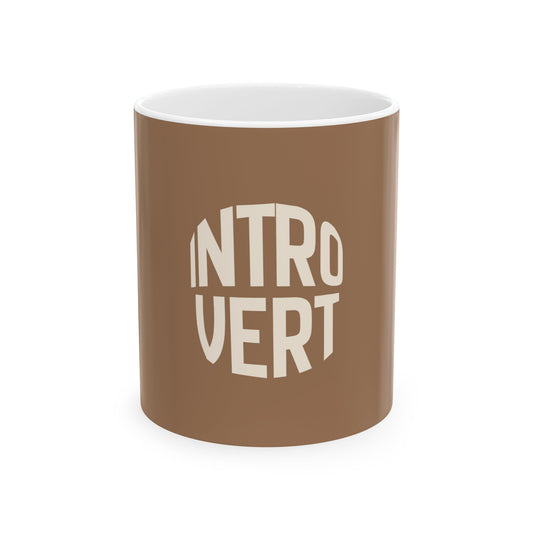 Brown mug with 'INTROVERT' text on a white background
