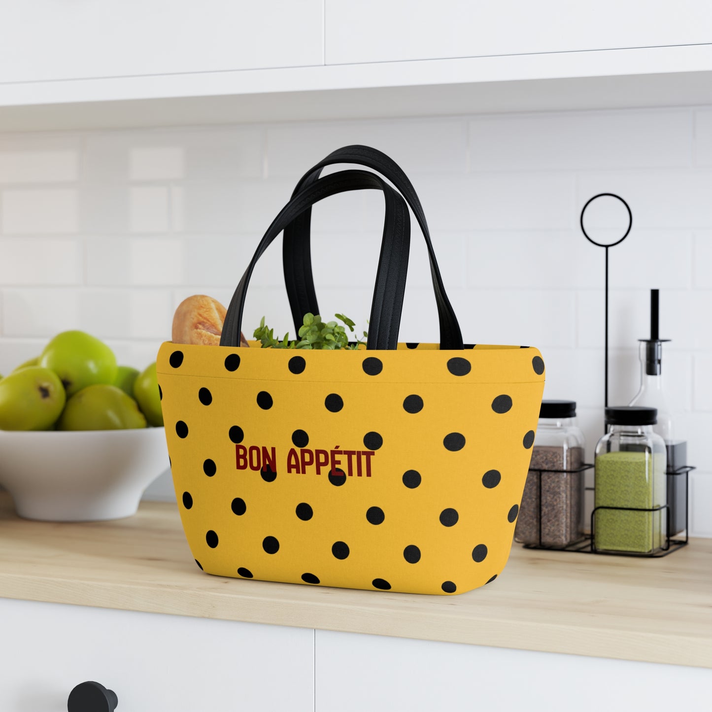 Yellow polka dot bag with 'Bon Appetit' text on a kitchen counter