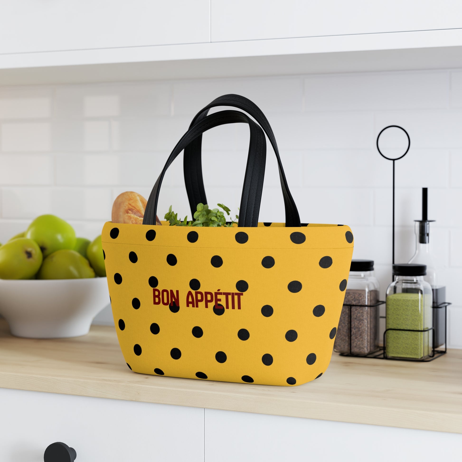Yellow polka dot bag with 'Bon Appetit' text on a kitchen counter