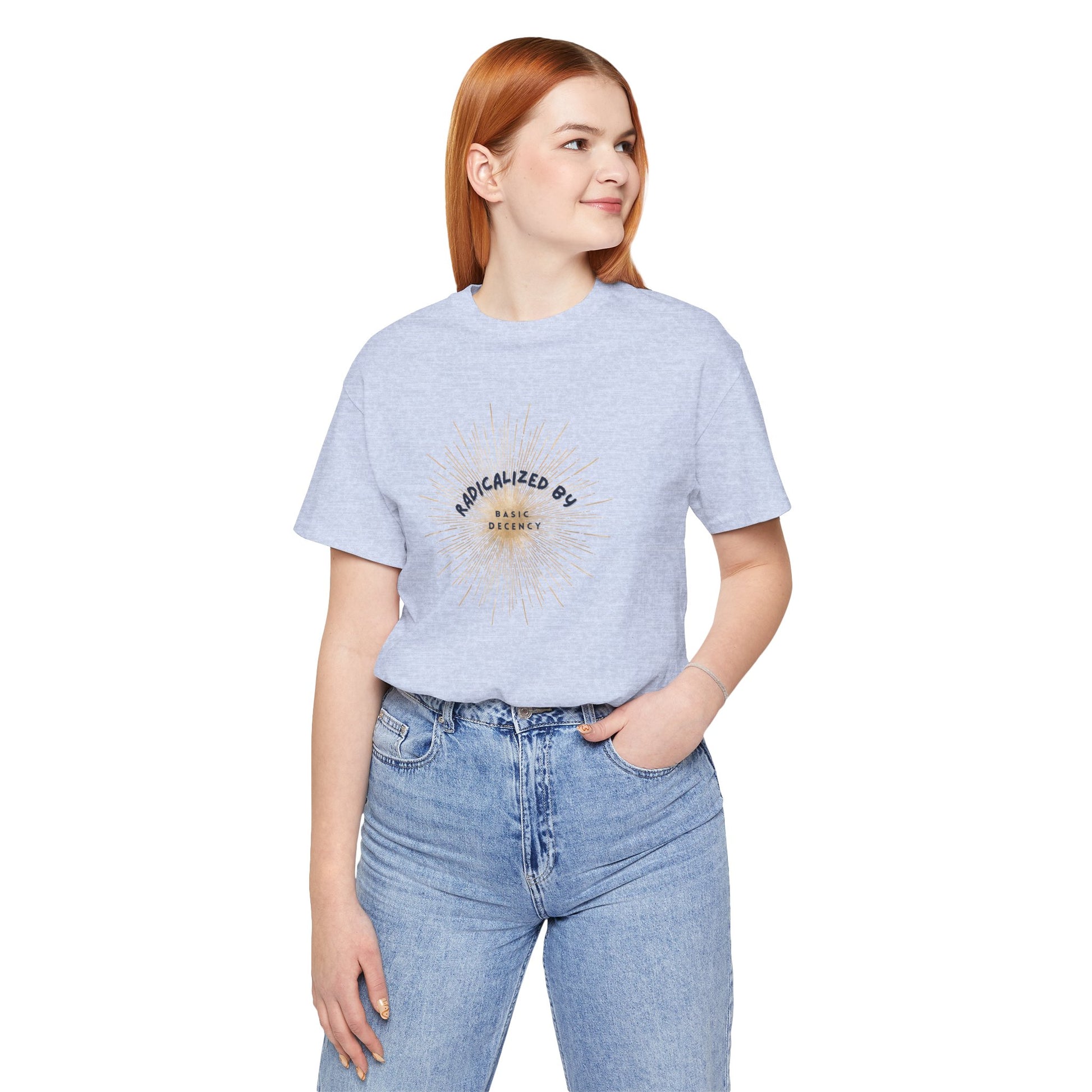 Person wearing a light blue t-shirt with text and graphics, standing against a white background