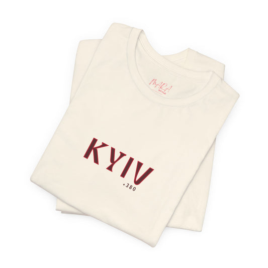 Folded beige tank top with 'KYIV 380' text on a white background