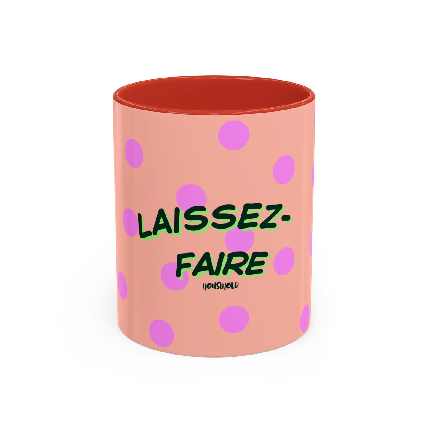 Pink polka dot mug with green text on a white background