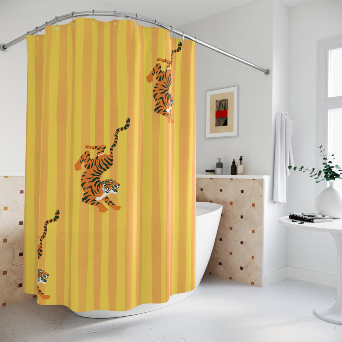 A yellow shower curtain with vertical stripes and cartoon tigers climbing down the curtain, shown hanging in a bright modern bathroom.