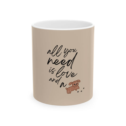Beige mug with text 'all you need is love and a' and a small dog illustration on a white background