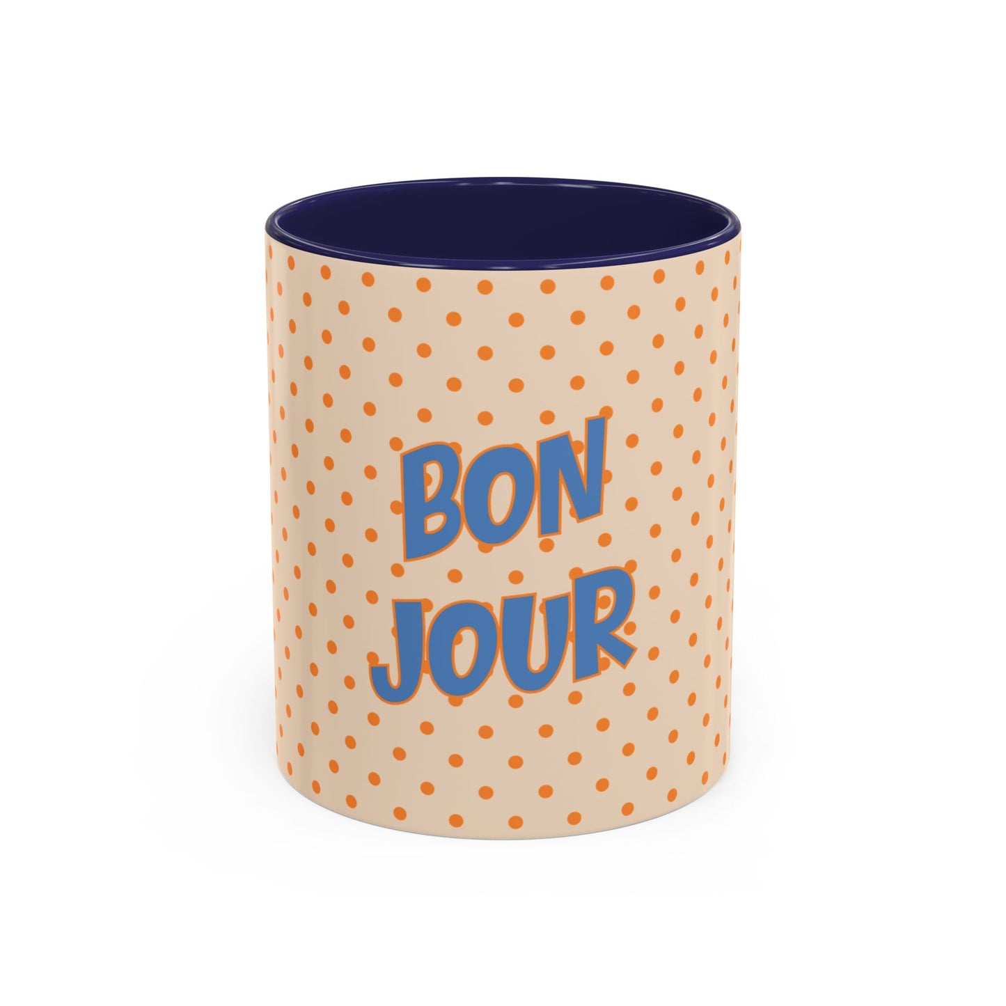Mug with polka dot pattern and 'Bonjour' text on a white background