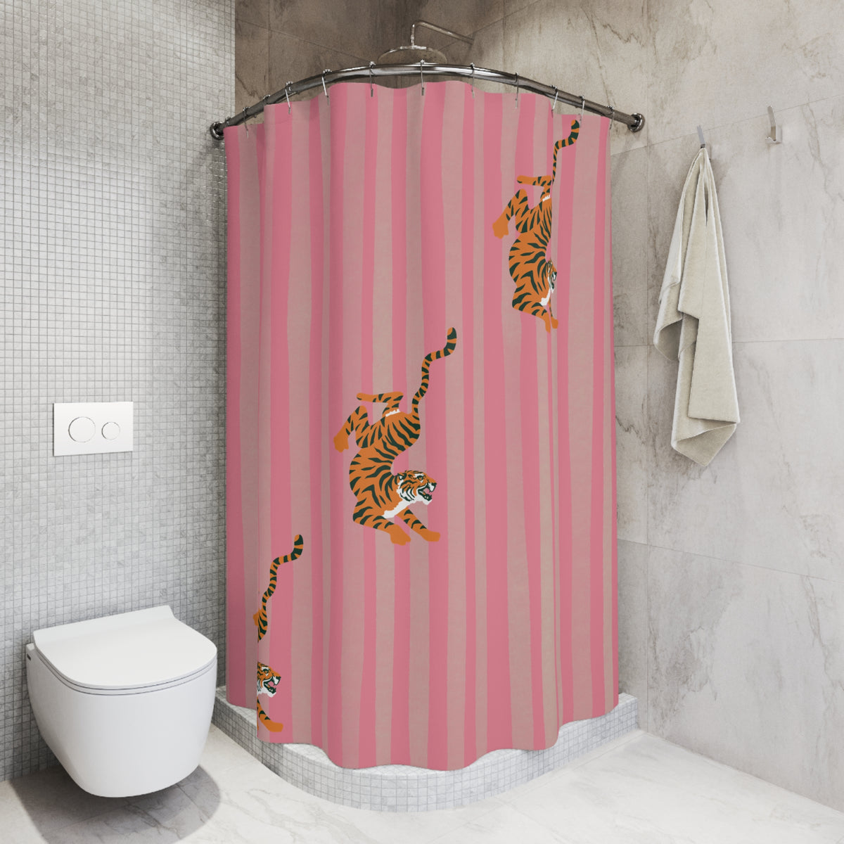 Pink shower curtain with vertical stripes and tiger illustrations, hanging in a modern tiled bathroom next to a toilet and towel.