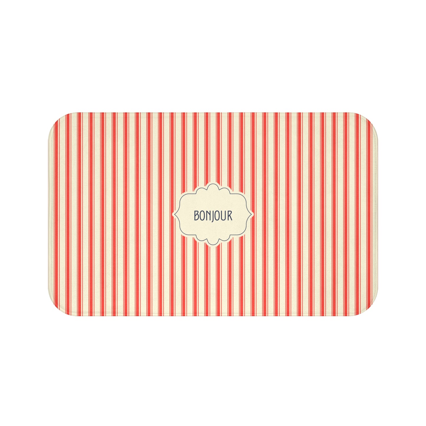 A bath mat with rounded corners, featuring vertical red and cream stripes and a central cream label with the word 'BONJOUR' in black text.
