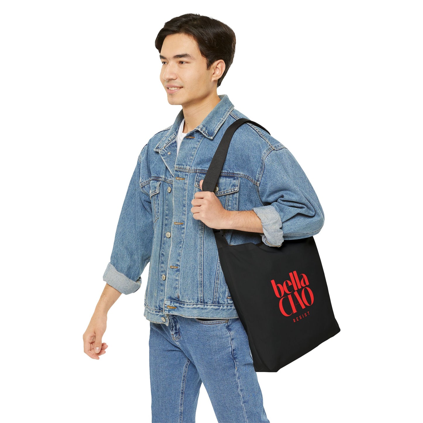 Man holding a black tote bag with 'bella clo' branding on a white background