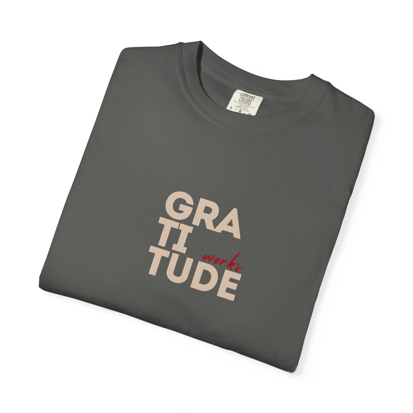Folded gray t-shirt with 'GRATITUDE' text on a white background