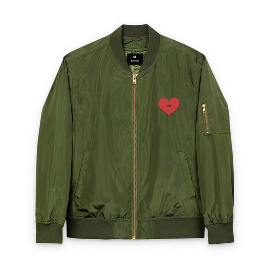 Green bomber jacket with a red heart patch on a white background