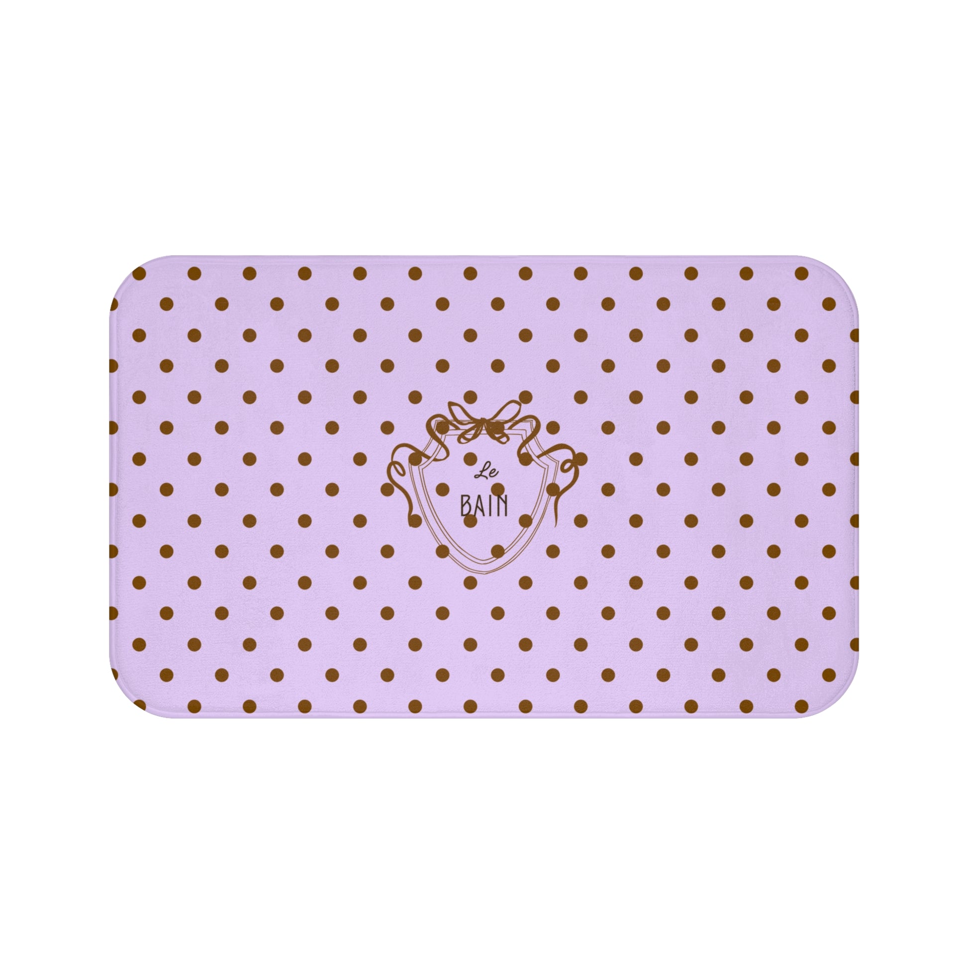Purple bath mat with gold polka dots and a logo on a white background