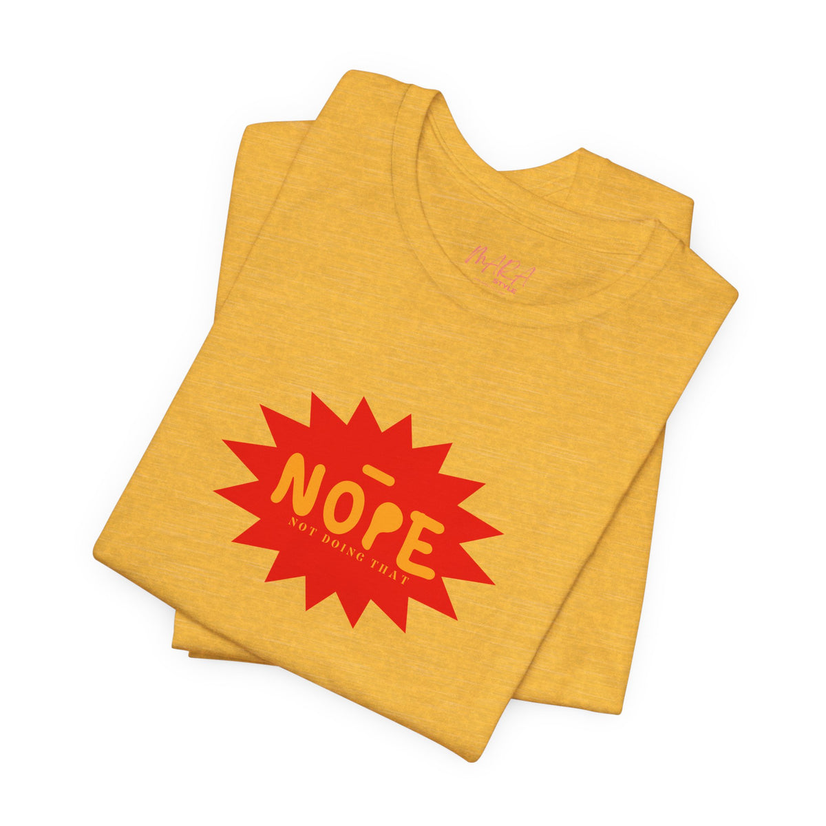 A folded heather yellow t-shirt with a red starburst graphic on the front that reads 'NOPE NOT GOING TO BE' in yellow, shown on a plain white background.
