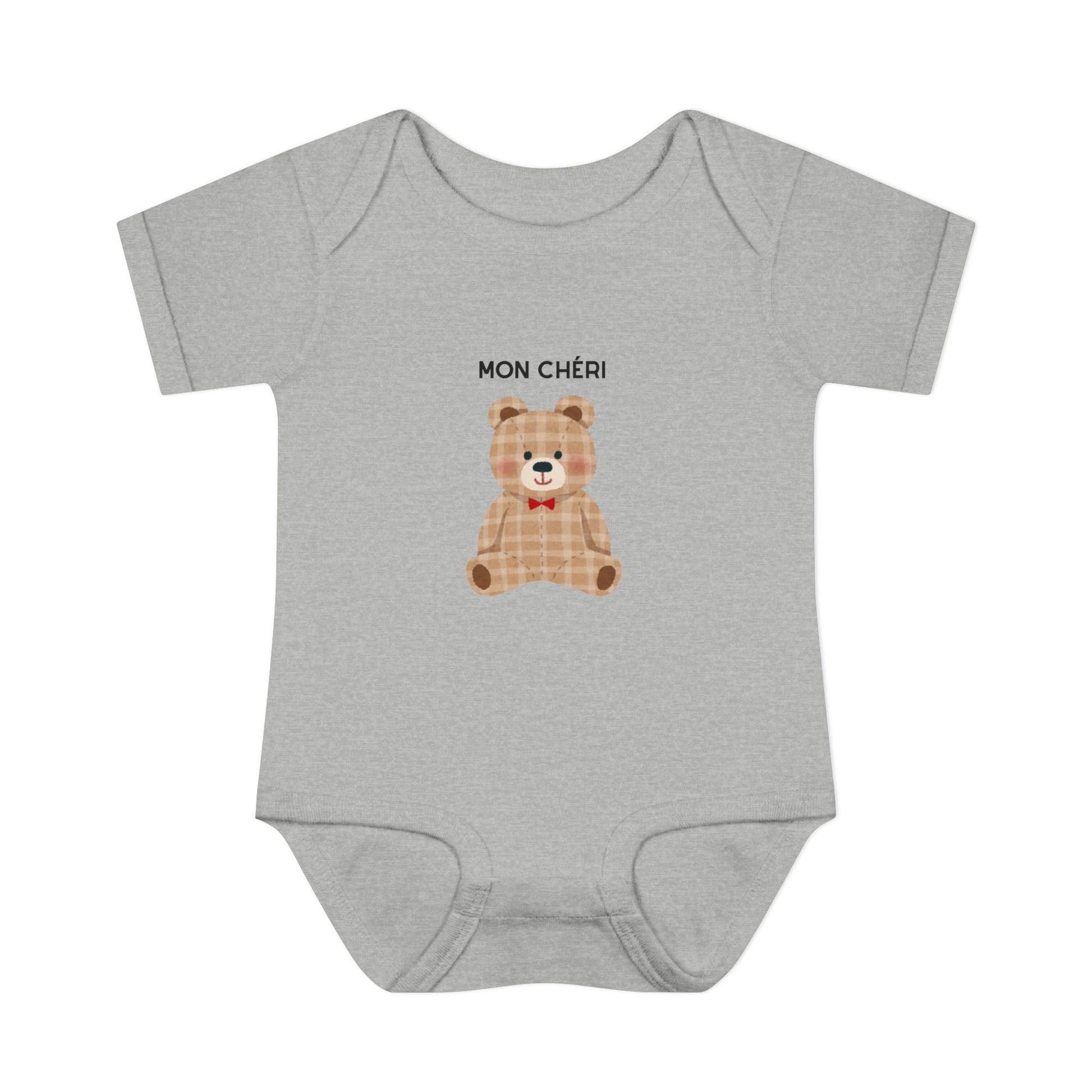 Gray baby onesie with a teddy bear graphic and 'MON CHÓRI' text on a white background
