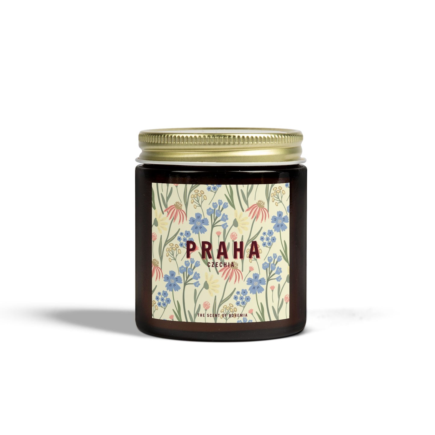 Candle jar with floral label and 'Praha' text on a white background
