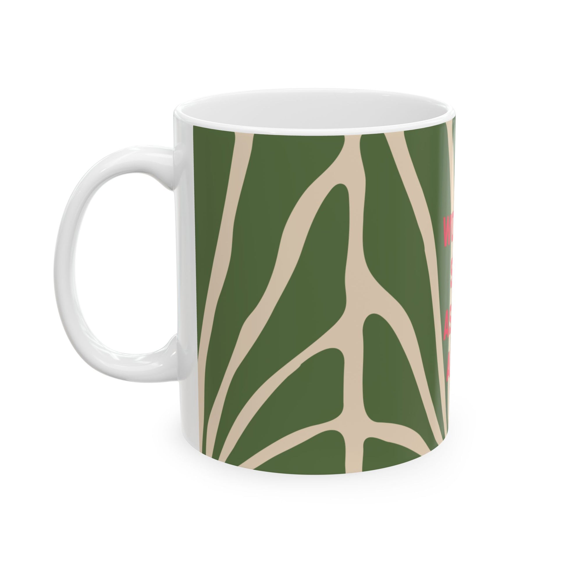 White mug with a green and beige abstract pattern on a white background
