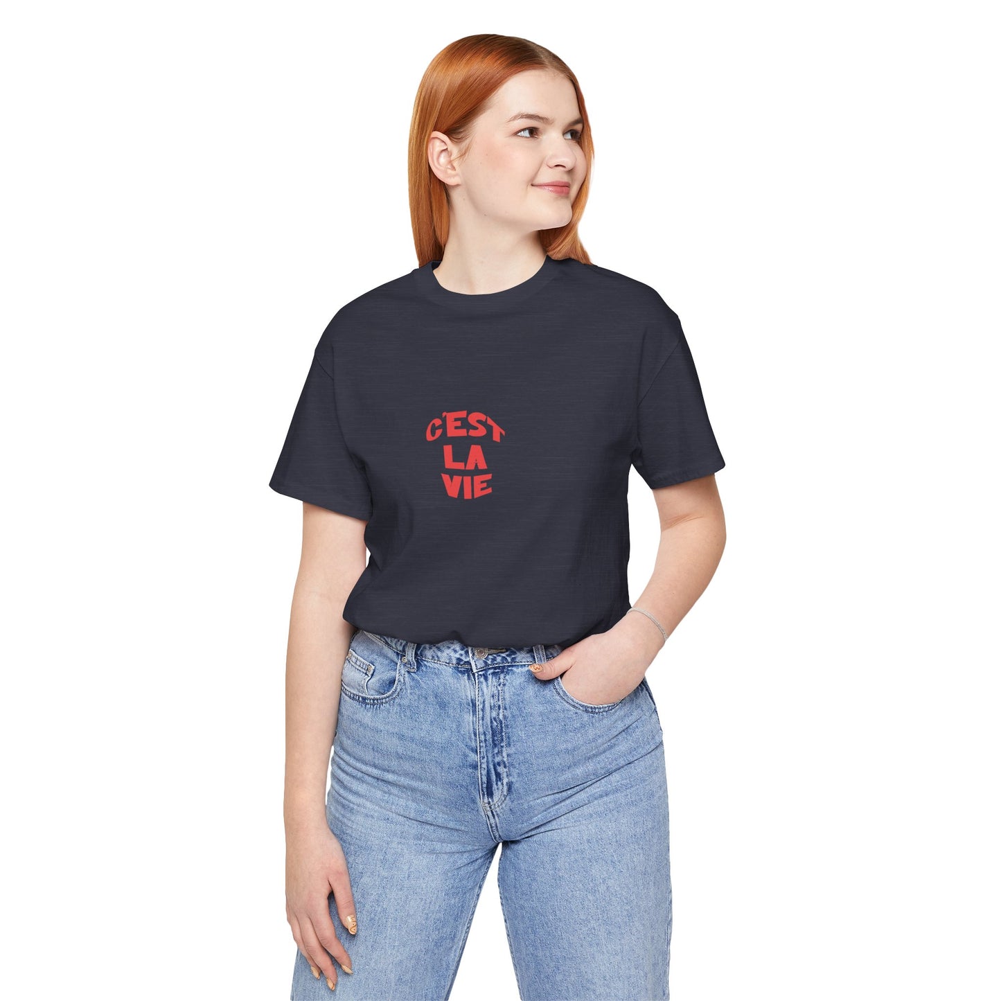 Person wearing a black t-shirt with red text and blue jeans on a white background