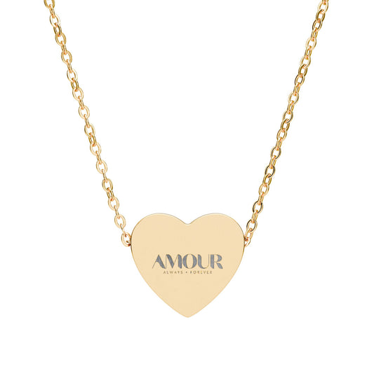 Gold heart-shaped necklace with 'AMOUR' engraving on a white background