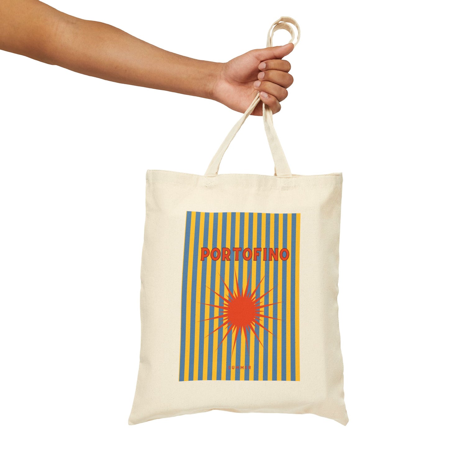 Tote bag with 'Portofino' design held by a hand on a white background