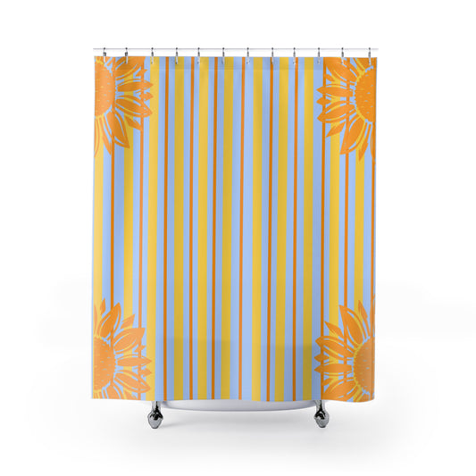 Shower curtain with orange floral patterns and blue and yellow vertical stripes on a white background